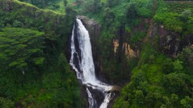 Tropical Devon Falls in mountain jungle. Waterfall in the tropical forest.