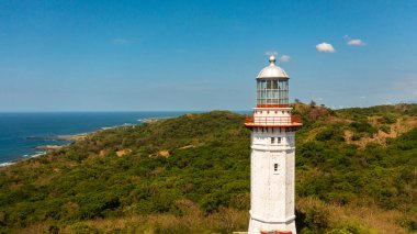 Lighthouse on hill. Cape Bojeador Lighthouse, Ilocos Norte, Philippines.