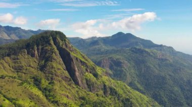 Aerial view of Mountains and green hills in Sri Lanka. Slopes of mountains with evergreen vegetation.