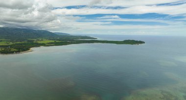 Aerial view of coastline of the island with jungle and beaches. Negros, Philippines