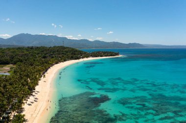 Tropical landscape with beautiful sandy beach and blue sea. Pagudpud, Ilocos Norte Philippines