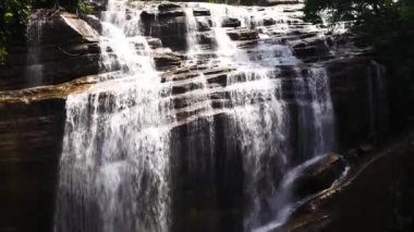A beautiful Olu Ella Falls waterfall in the mountains among the jungle. Sri Lanka.