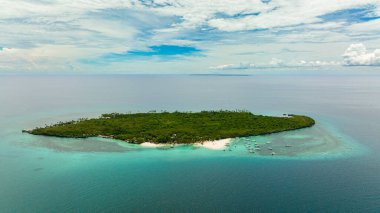 Aerial view of tropical island with a beach in the open ocean. Virgin Island, Philippines.