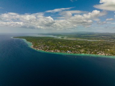 Aerial drone of coast of Moalboal with hotels and dive centers. A popular place for divers. Philippines, Cebu.