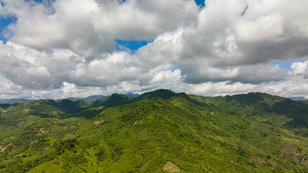 Top view of Mountain slopes covered with rainforest and jungle. Philippines. View of the valley in the mountain province.