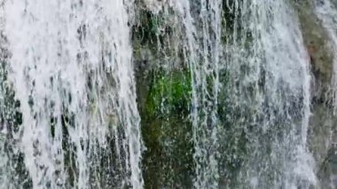 Waterfall in the green forest. Lusno Fallsin slow motion. Cebu, Philippines.