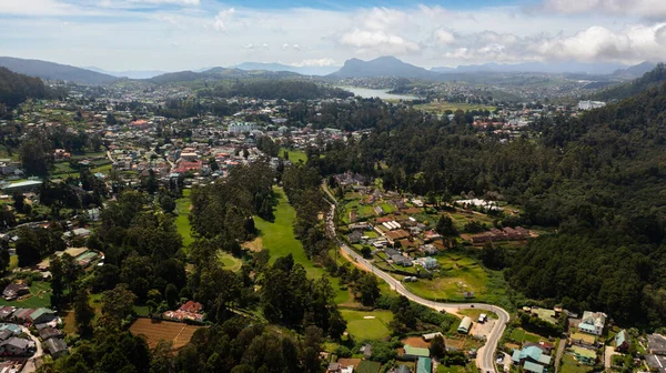 Top view of mountain town of Nuwara Eliya among tea plantations in mountains. Sri Lanka.