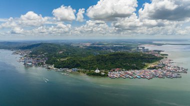 Aerial view of city of Sandakan on the seashore on the island of Borneo, Malaysia. clipart