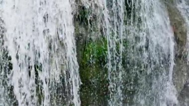 Waterfall in the green forest. Lusno Fallsin slow motion. Cebu, Philippines.