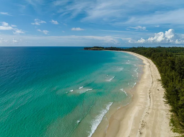 stock image Beautiful sandy beach with trees and sea surf with waves. Kalampunian Beach. Borneo, Malaysia.