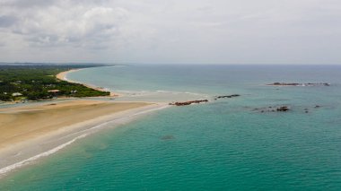 Sandy beach and turquoise water. Nilaveli Beach, Sri Lanka, Trincomalee. Summer and travel vacation concept.