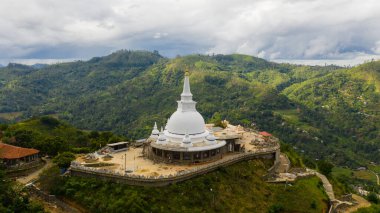 Mahamevnawa Buddhist Monastery temple in the mountain top. Bandarawela, Sri Lanka. clipart