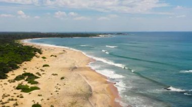 Top view of a beautiful sandy beach and ocean with waves. Sri Lanka.