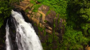 Waterfall in the jungle. Devon Falls in the rainforest. Sri Lanka.