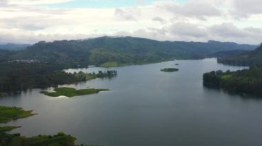 Aerial drone of Lake in the mountains among the tea plantations. Maskeliya, Maussakelle reservior, Sri Lanka.