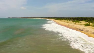 Tropical landscape with beautiful sandy beach and blue sea. Sri Lanka.
