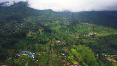 Agricultural land in the mountains among the jungle and rainforest. Ramboda, Sri Lanka.