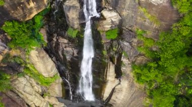 Aerial drone of Waterfall in the tropical mountain jungle. Rawana Falls, Sri Lanka.