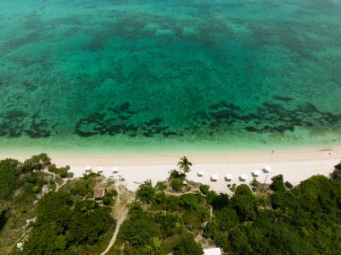 Top view of tropical sandy beach and blue sea. Bantayan island, Philippines. clipart