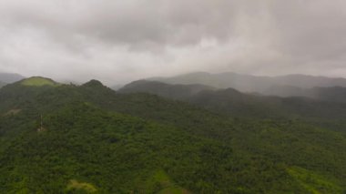 Aerial view of Mountain peaks covered with forest from above. Philippines.