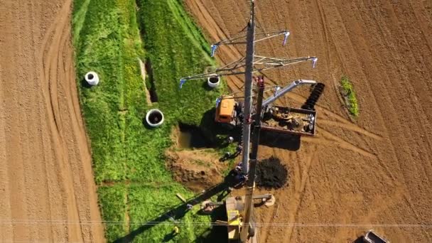 Aerial Drone Construction Machinery Erects Pole High Voltage Line Power — Stock Video