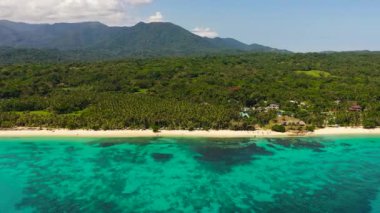 Aerial Seascape with tropical sandy beach and blue ocean. Pagudpud, Ilocos Norte, Philippines.