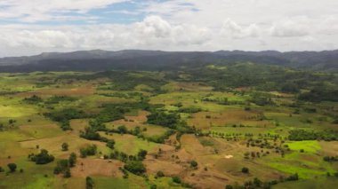 Mountains with green forests and agricultural land with farm plantations. Philippines.