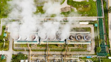 Aerial view of geothermal power plant in a mountainous province. Renewable energy production at a power station. Negros, Philippines. clipart