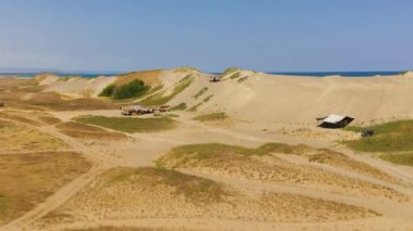 Aerial view of Paoay sand dune. Sand dunes near to the sea with sky. Ilocos Norte, Philippines.