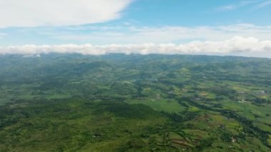 Aerial view of valley with farmland and agricultural land in mountainous area. Negros, Philippines