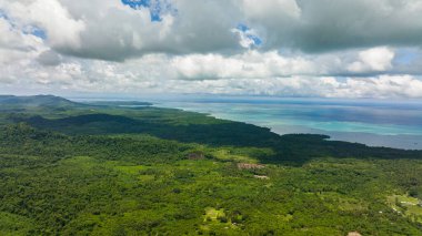 Aerial view of island with jungle and blue sea. Seascape in the tropics. Balabac, Palawan. Philippines.
