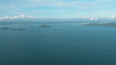 Aerial drone of tropical islands in the blue sea against the background of the sky and clouds. Philippines.