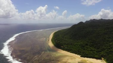 Aerial drone of tropical island coastline and blue ocean. Luzon, Santa Ana, Cagayan. Philippines.