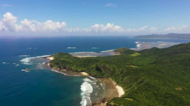 Top view of coast of the island with beaches and rainforest. Cape Engano. Palaui Island. Santa Ana Philippines.