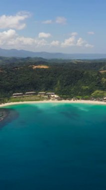 Tropical landscape with beautiful sandy beach and blue sea. Pagudpud, Ilocos Norte, Philippines.