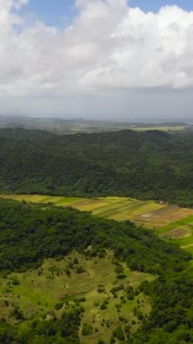 Mountains with green forests and agricultural land with farm plantations. Philippines.