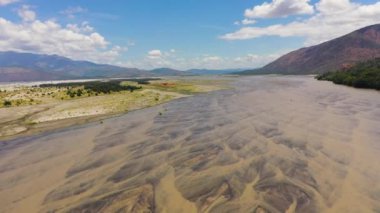 A shallow river bed in a mountain valley. Bucao river. Luzon, Philippines.
