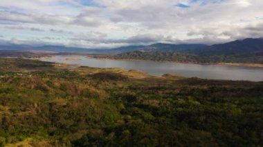 Lake in a valley among mountains with tropical vegetation. Philippines.