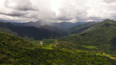 Mountains with green forests and agricultural land with farm plantations. Philippines.