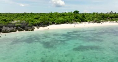 Tropical sandy beach and blue sea. Bantayan island, Philippines.