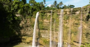 A tropical Niludhan waterfall in the jungles. Negros, Philippines.