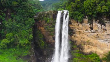 Waterfall in the green forest. Laxapana Falls in the jungle. Sri Lanka.