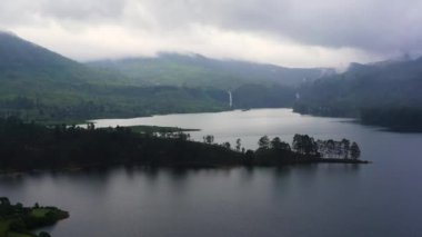 Aerial view of Lake in the mountains among the tea plantations. Maskeliya, Maussakelle reservior, Sri Lanka.