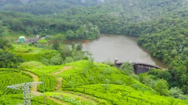 Water dam and reservoir lake, generating hydro electricity power renewable energy. Sri Lanka.