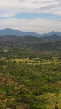 Top view of Rustic landscape with agricultural lands and farms among mountains and forests. Sri Lanka.