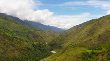 Aerial view of mountains and rice fields against the blue sky. Philippines, Luzon.