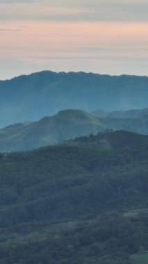 Mountains and green hills at sunset. Negros, Philippines