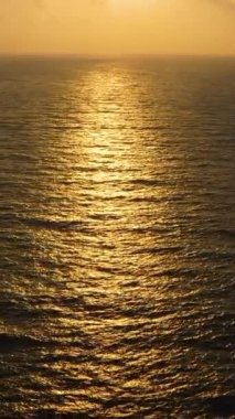 Sun reflecting in the ocean water during sunset.