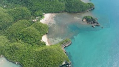 Tropical sandy beach and blue sea. Negros, Philippines