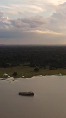 Aerial view of sunset over the lake in the national park. Sri Lanka.